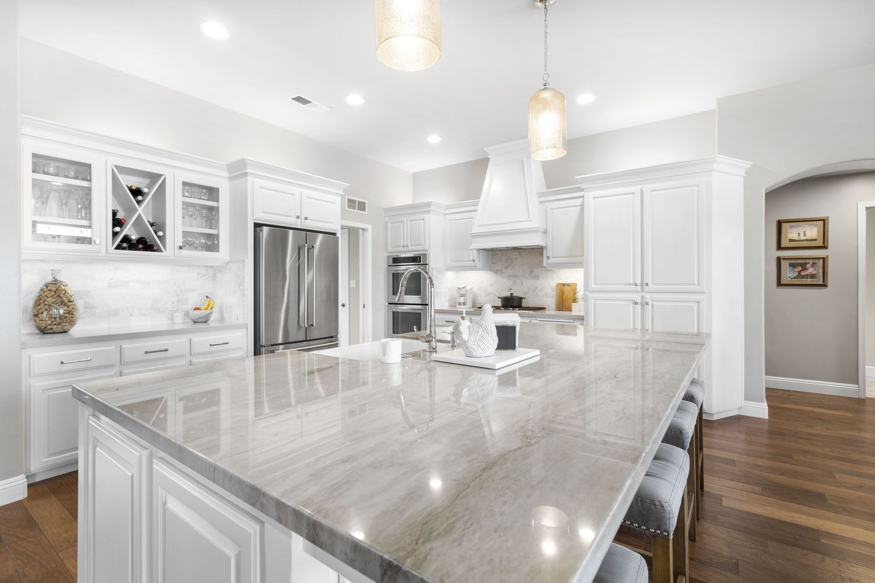 Bright white kitchen with marble island