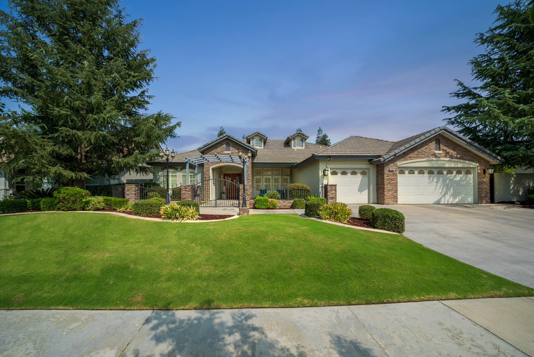 Bakersfield home exterior from day to dusk